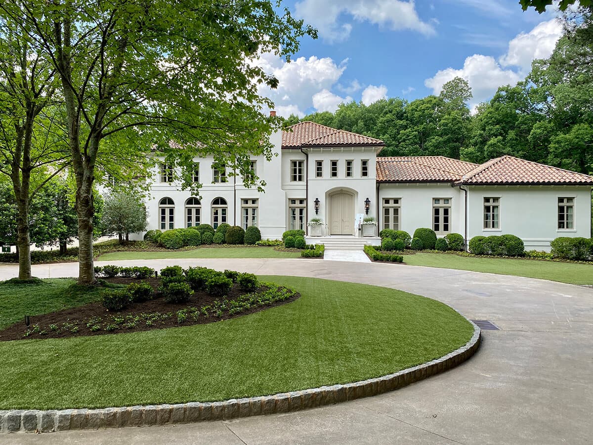 Modern kitchen with marble countertops and bar stools